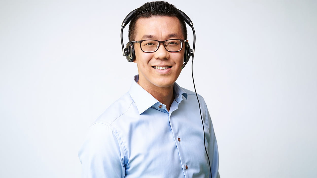 Asian male freight forwarder wearing a headset
